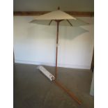 Two 2 metre garden parasols with wooden slats and poles, no bases, in as new condition