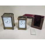 A brass carriage clock 14cm tall, small cracking to dial, chip to front glass, running - and another