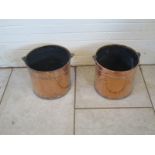 A pair of copper buckets with brass handles - 33cm H x 41cm W