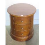 A Willis and Gambier mahogany circular three drawer bedside chest, 60cm H x 54cm diameter