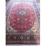 A hand knotted, woollen Tabriz rug, approx. 300cm x 200cm, in good condition