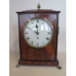 A Regency brass inlaid mahogany bracket clock with an arch top fusee movement standing 36cm tall, on