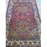 A Zanjan hand knotted woollen and cotton rug, with cream field, 197cm x 126cm - in generally good