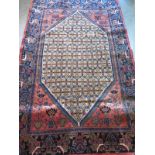 A hand knotted woollen Hamadan rug, approx. 200cm x 126cm, in good condition