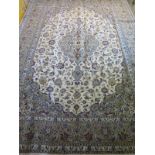 A hand knotted, woollen Kashan rug, caucasian ground, approx. 285cm x 200cm, in good condition