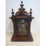 A 19th century walnut striking mantel clock, 50cm H, Arabic dial, with key, currently running in the