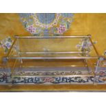 Pierre Vandel two tier table with lucite supports and outswept corners, bevelled glass top and glass