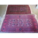 Two hand knotted rugs, some wear to both, paint to underside of one, largest 180cm x 90cm