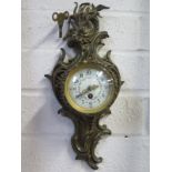 A 19th century cartel clock, brass case, with Arabic dial, convex glass approx 29cm long, with key