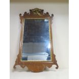 A Georgian style mahogany phoenix wall mirror 69cm x 39cm