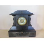 A large Victorian black marble mantle clock, 45cm tall, 48cm wide, some small chips, ticks but stops