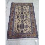 A hand knotted woollen Baluchi rug - 176cm x 114cm