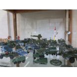 An assortment of die cast military vehicles including Dinky, Britains, and Lesney, all play worn,