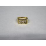 An 18ct gold gents millennium ring inset with five diamonds, stamped 750, approx 11.2 grams, size S,