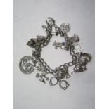 A silver charm bracelet, approx 1.5 troy oz, some wear, see images