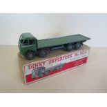 A Dinky Toys Foden flat truck 1st cab, green and black, boxed no 502 - some general play wear but