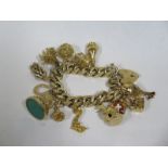 A 9ct gold charm bracelet with thirteen charms, total weight approx 110 grams, some usage but