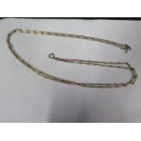 A 9ct yellow gold double chain - 71cm long, total weight approx 33 grams, with a plated clasp,