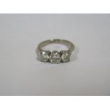 An 18ct white gold three stone diamond ring, size M, central diamond approx 0.70ct flanked by two
