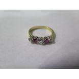 An 18ct diamond and pale ruby ring, size L, approx 2.7 grams, some rubbing and general wear