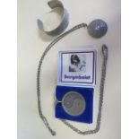 Three pieces of Jorgen Jensen pewter jewellery to include a Yin Yang pendant on chain, a bangle no