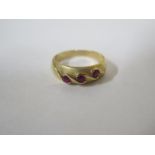 A 14ct gold three stone ruby ring, approx 2.7 grams, size O/P some scratches consistent with regular