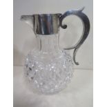 A cut glass claret jug with silver top - London WC JL 1898/99 - 19cm tall - generally good condition