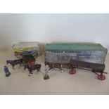 A Britains Farm Tumbrel cart no 4F boxed and a Timber carriage no 12F boxed - some play wear, arm