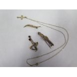 Two 9ct gold brooches, a 9ct crucifix on chain, total weight approx 5.6 grams, and a 14ct gold