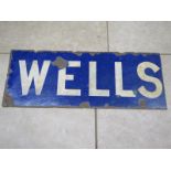 An enamel railway station sign - Wells - Norfolk - approx 37.5cm x 95cm, some rust