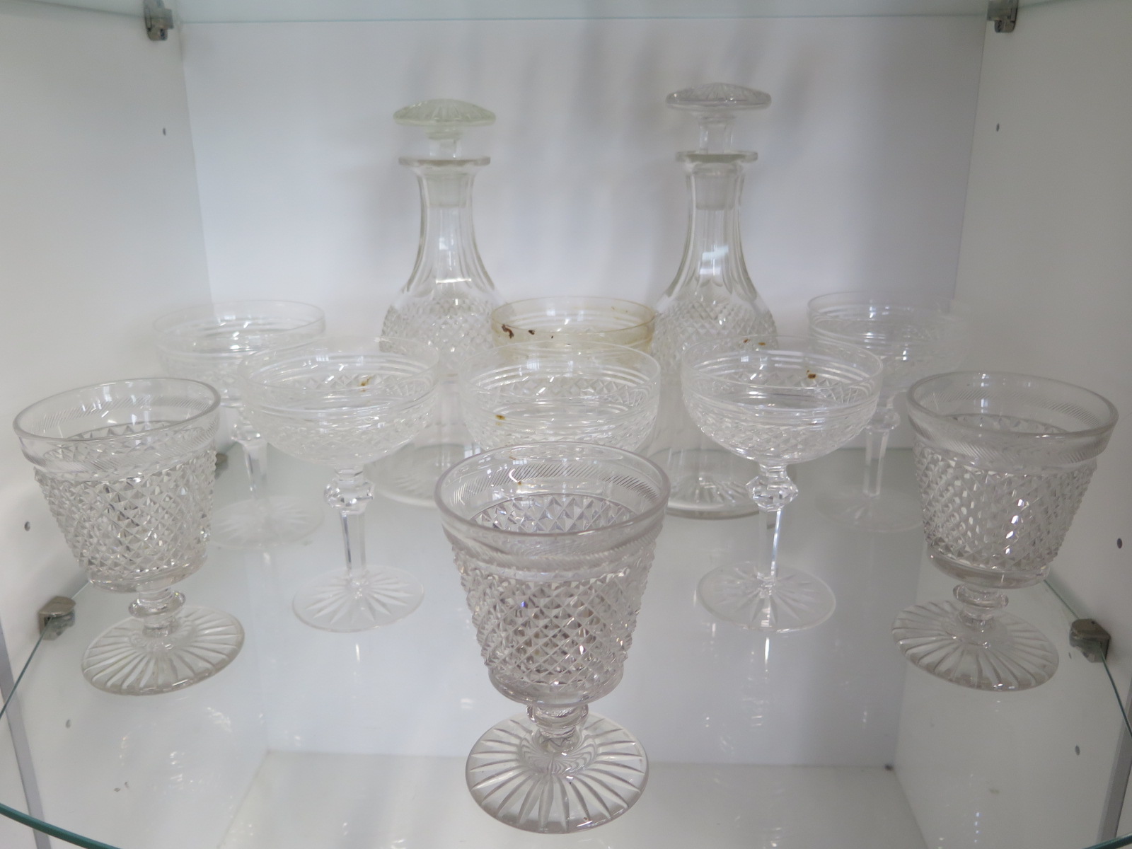 A selection of 19th Century and later glass wear, including a pair of decanters, three jugs, a