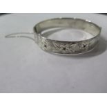 A decorative silver bangle Lodon 1964/65 GJld for Gerog Jensen, approx 36 grams, some usage but