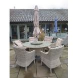 A Bramblecrest Ascot 140cm round table, six Ascot armchairs, 3m aluminium parasol in sand colour