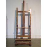 A mahogany artist studio easel by Rembrandt