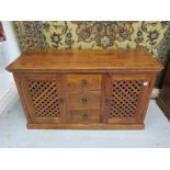 A John Lewis Maharani cabinet with three central doors, flanked either side by a lattice work door -