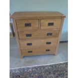 An oak two over three chest of drawers - slight chip to top, see images - W90cm x D40cm x H95cm