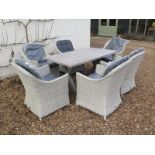 A Bramblecrest Monterey 155cm ceramic rectangle dining table and six Monterey armchairs - RRP £2,093