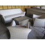 A Bramblecrest Monte Carlo three seater sofa, two armchairs and a coffee table with a side post
