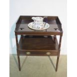 A 19th Century mahogany wash stand with a Masons ironstone bowl and jug above base, drawer on ring