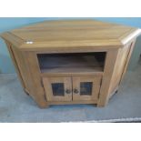 An ex display oak corner TV unit - W105cm x D55cm x H65cm