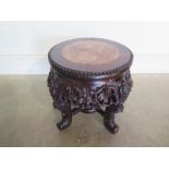 An Oriental marble top carved mahogany jardiniere stand, with good colour, in good condition - H34cm