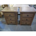 A pair of solid oak three drawer bedside chests - W50cm x D38cm x H63cm