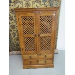 A John Lewis Maharani cabinet with two lattice work doors above four small drawers, 149cm H x 86cm x