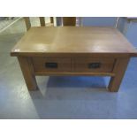 An oak double sided coffee table - W93cm x D60cm x H45