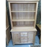 A modern beech dresser with a shelved top over base with drawers and cupboard doors, W97cm x H67cm