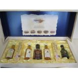 A Highland Distilleries centenary collection f whisky miniatures, with presentation box, booklet and