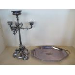 A silver plated triform centrepiece 58 cm tall, and a plated tray 59cm wide, the centre piece with
