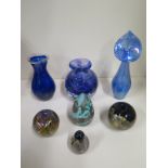 A collection of seven pieces of Isle of Wight and similar style glass vases, four paperweights and