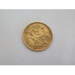 A 1909 Edward VII gold half sovereign, approx 4 grams, in good overall condition but with some signs