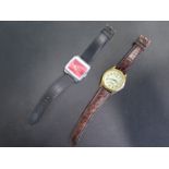 A vintage Zurich manual wind digital jump hour wristwatch, 37mm wide including button, and a Lorus